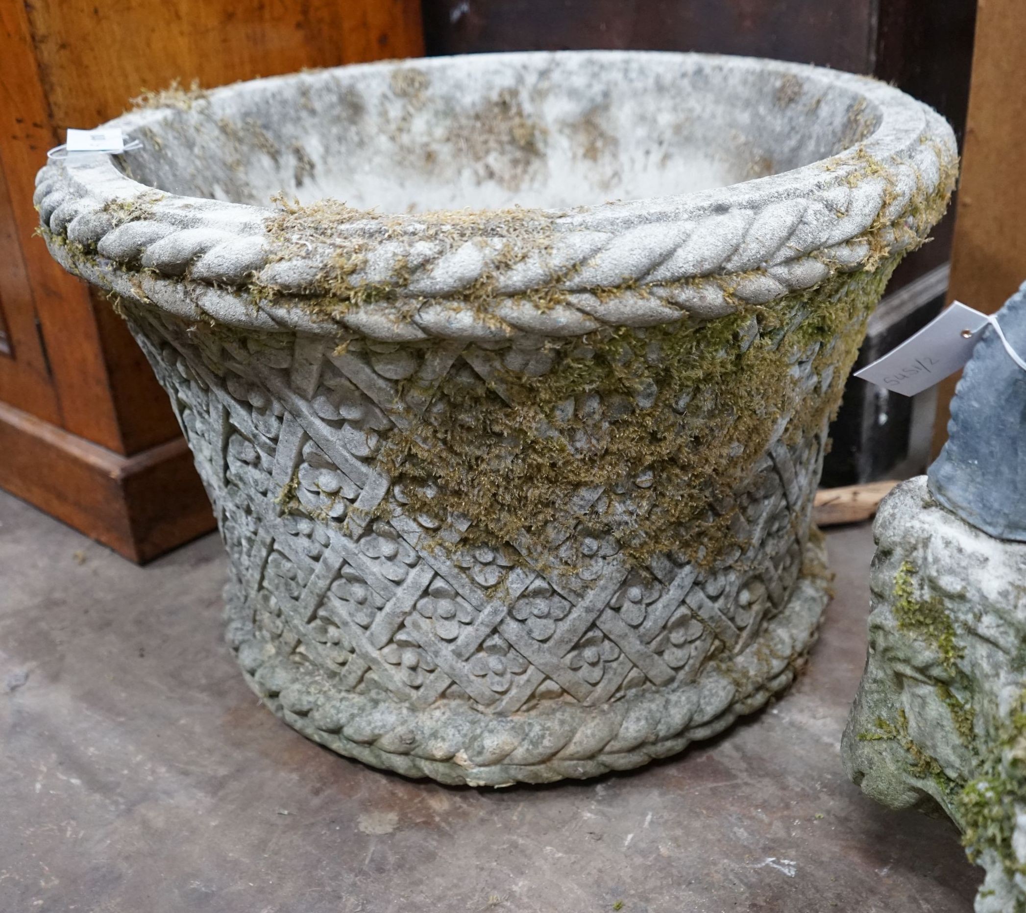 A large circular reconstituted stone garden planter, diameter 62cm, height 40cm